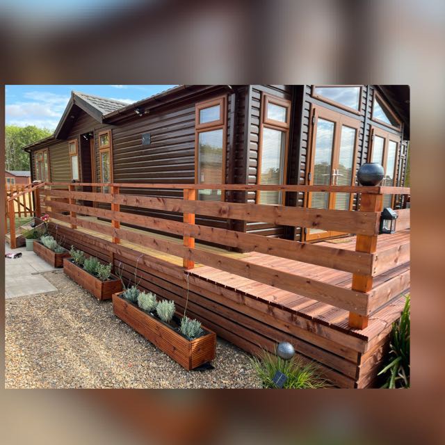 Completed holiday lodge and timber decking project